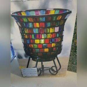 Beautiful and bright mosaic candle globe with black metal base. New in the box.